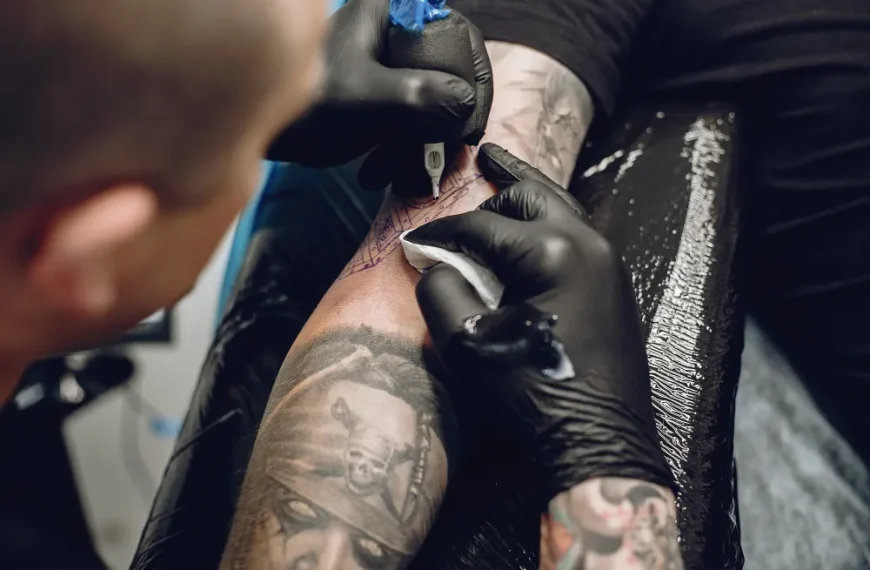 man doing tattoo