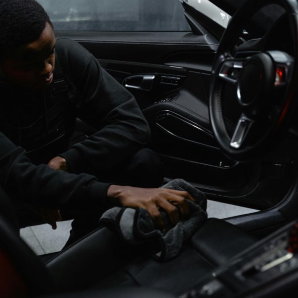 a man cleaning a car seat
