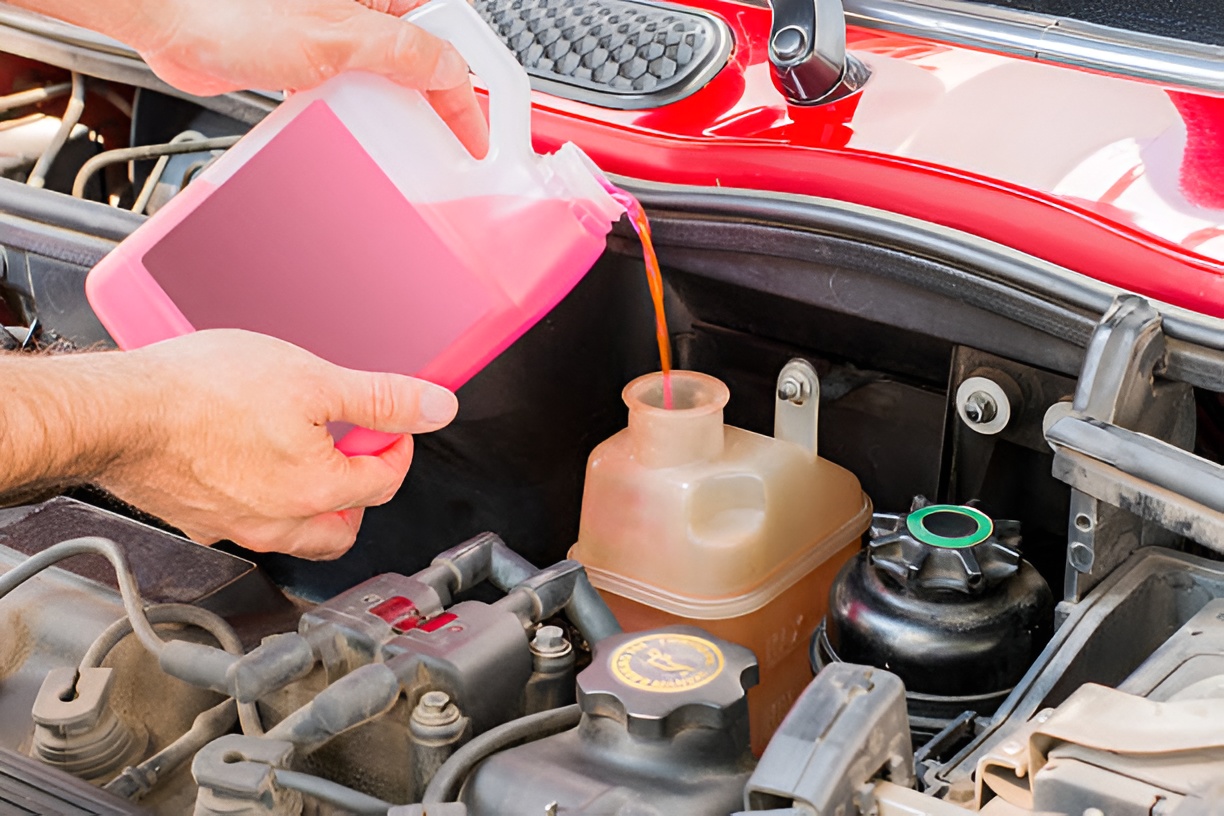 close-up of a man changing transmission oil